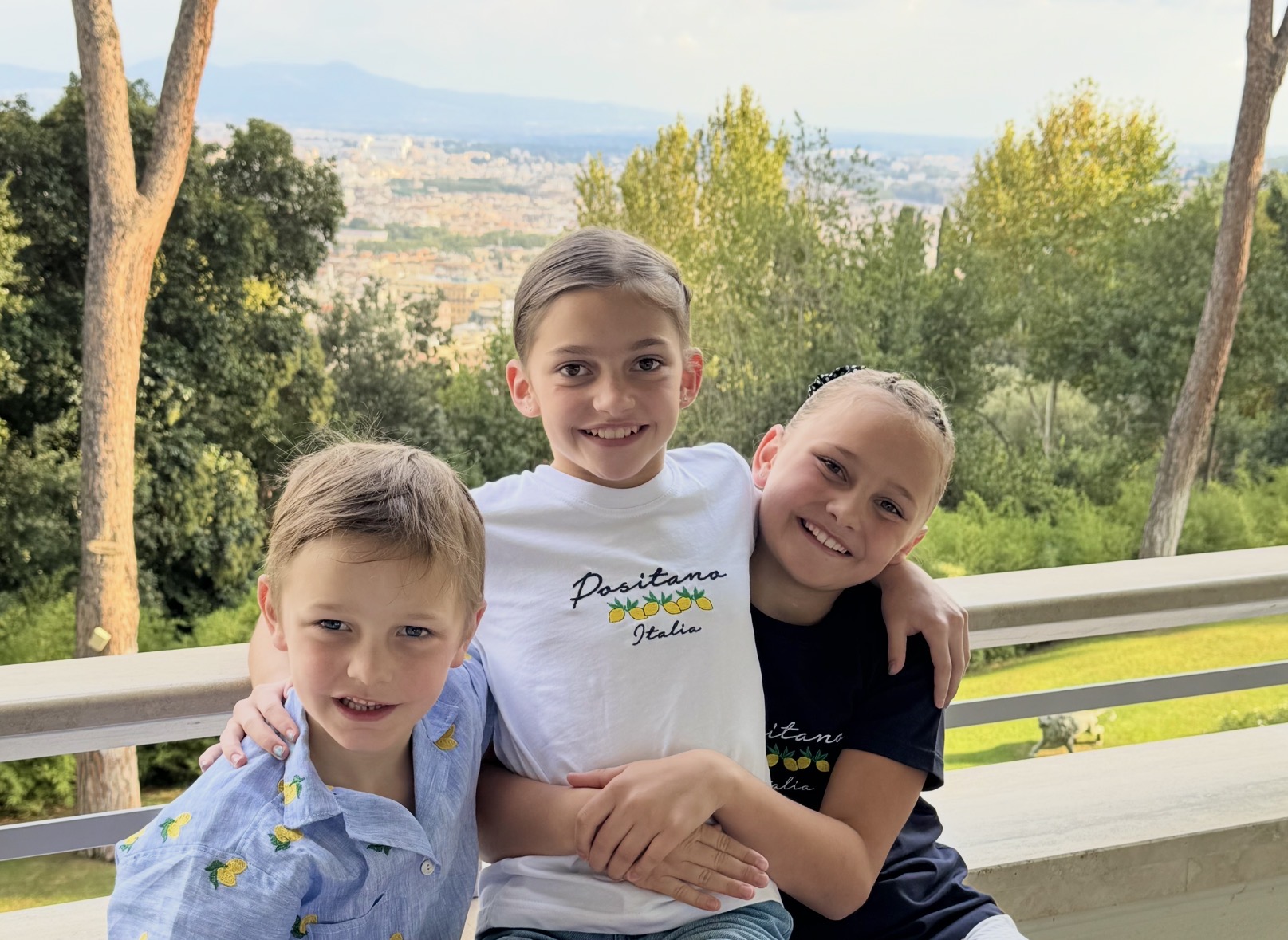 Juliana Austen in the centre with her sister Chantelle and brother James in Rome, Italy
